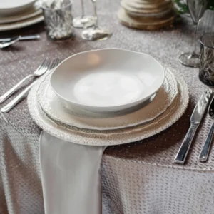 An elegantly decorated Clementine Copper table set with plates and silverware, perfect for any event or occasion.