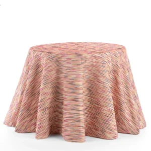 A round table with a Canyon Magenta tablecloth available for table linen rental.
