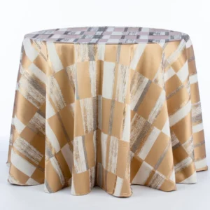 An elegant round table with a Metropolitan Champagne checkered cloth available for event or table linen rental.