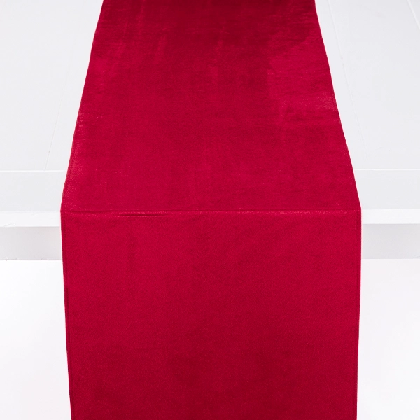 A Montana Suede Lipstick Table Runner rental on a white surface.