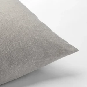 A close up of a Nola Grey Pillow available for table linen rental.