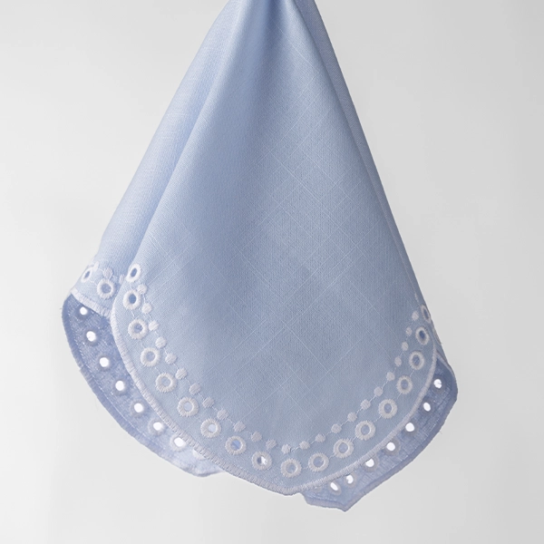 A Sadie Scalloped White Napkin with blue trim available for event linen rental.