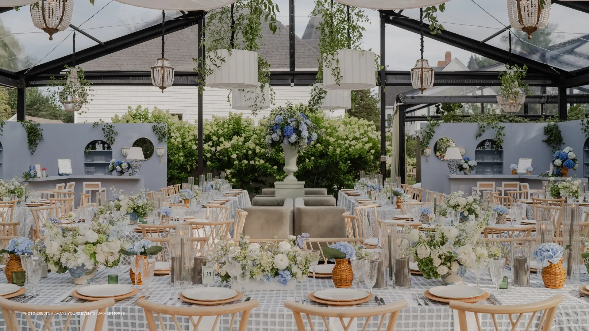 A set up of tables with chairs and event linen rental.