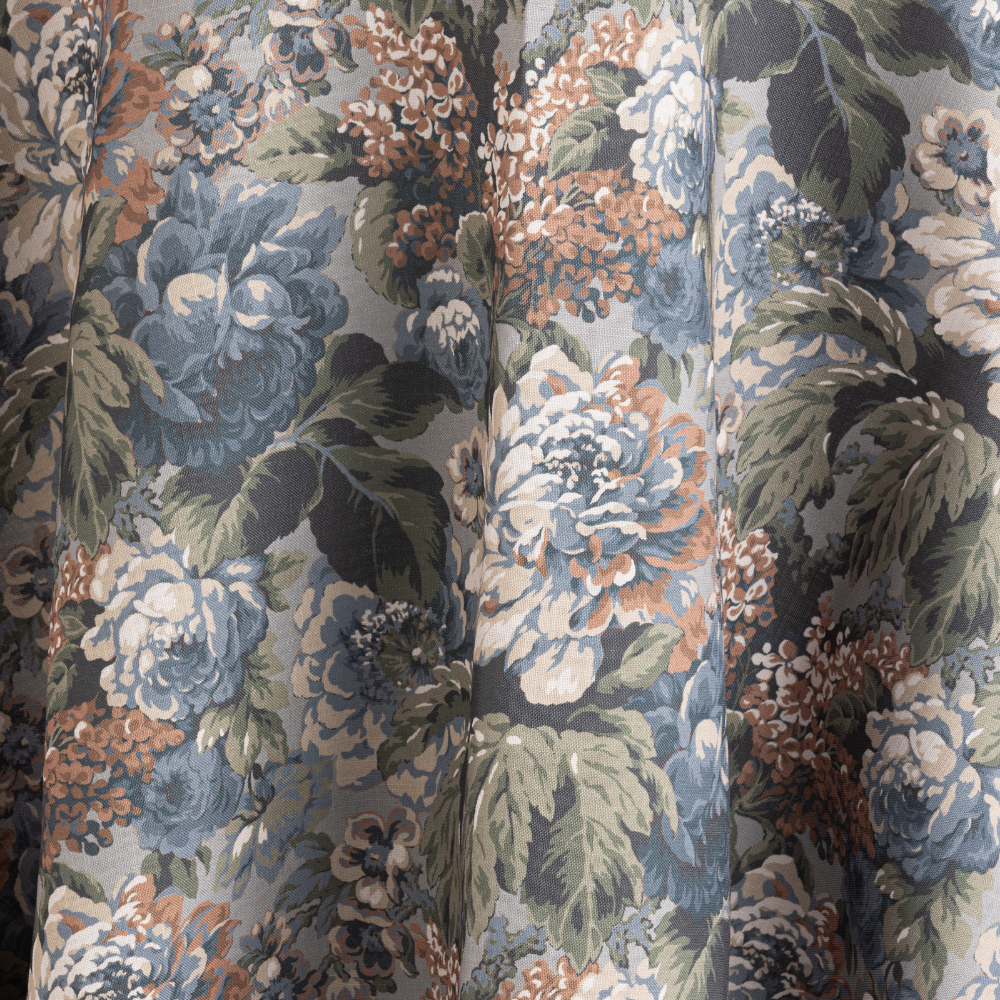 Close-up of Cafe Noir Velvet fabric showcasing a floral pattern with large blooms in shades of blue, green, and brown.
