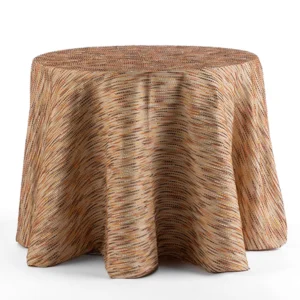 A round table is covered with a textured tablecloth featuring a brown and beige woven pattern.