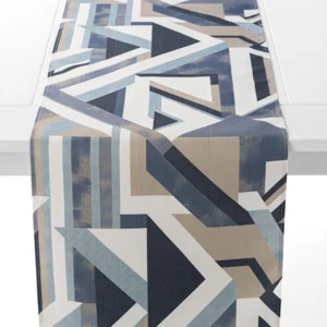 A table runner with a geometric pattern of overlapping shapes in blue, beige, and white shades, draped over a white surface.