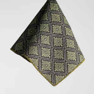 Hanging cloth with a geometric flower pattern in green and black, forming a grid design.