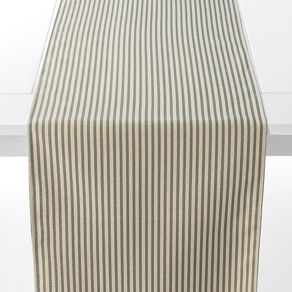 A striped table runner with vertical beige and green lines lies flat on a white table.