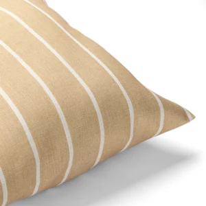 Close-up image of a beige pillow with white vertical stripes on a white background.