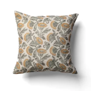 A square cushion with a floral pattern featuring yellow and green leaves and flowers on a white background.