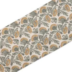 A piece of fabric with a repeating pattern of green and gold intricate floral designs on a light background.