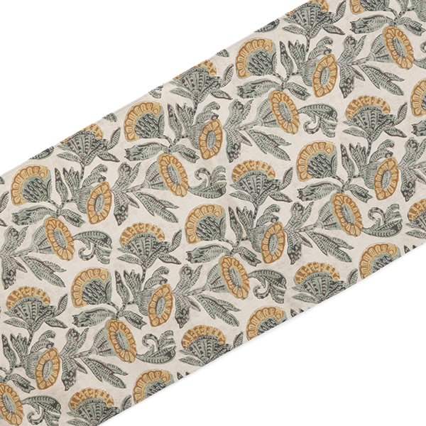 A piece of fabric with a repeating pattern of green and gold intricate floral designs on a light background.