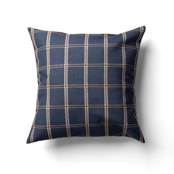 A square throw pillow with a blue and brown plaid pattern on a white background.