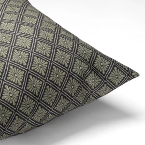 The Percival Olive Pillow features a geometric diamond pattern in green and black on a white background.