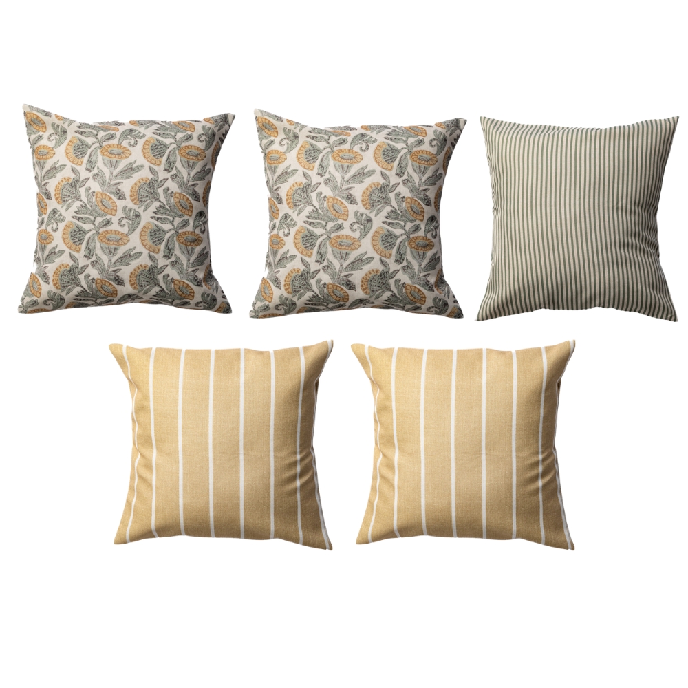 Five decorative pillows: three with floral patterns and two with stripes, arranged in two rows.