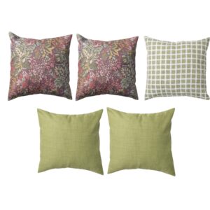 Five decorative pillows, two with a floral pattern, one with a green grid pattern, and two in solid green, are displayed against a white background.