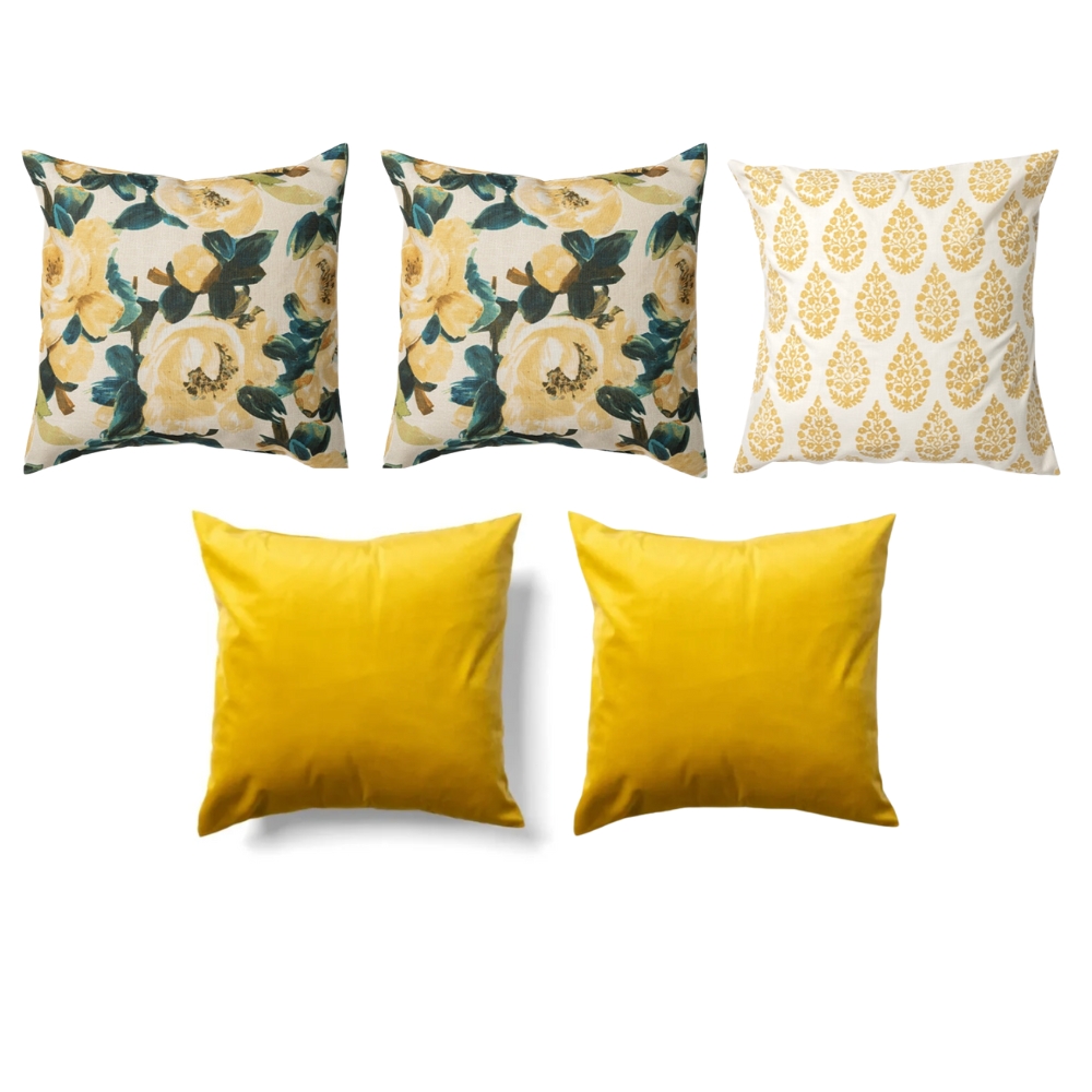 Five decorative pillows; three have floral and patterned designs in yellow and green, and two are solid yellow.