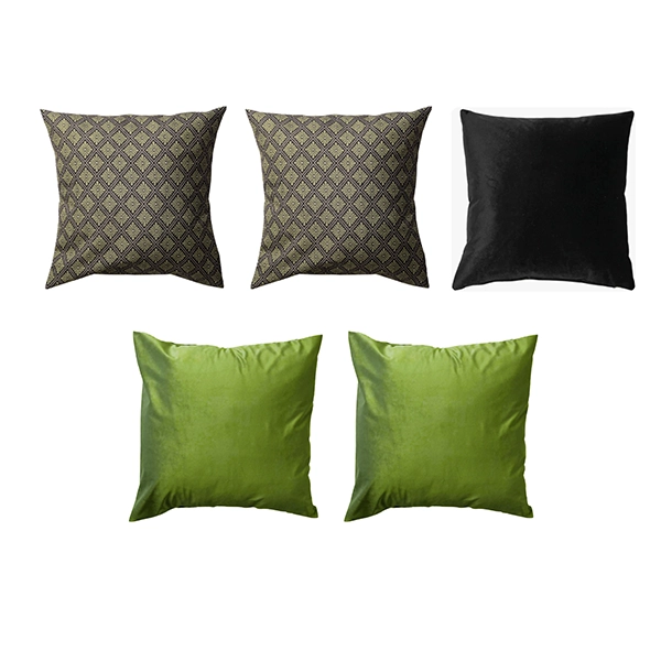 The Holly Berry Bliss Pillow Package features a set of five pillows, including two with a black-and-gold geometric pattern, one in solid black, and two in solid green, arranged in two rows.