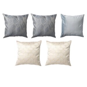 Five decorative pillows arranged in two rows. The top row has two gray patterned pillows and one solid gray pillow, while the bottom row features two white patterned pillows.