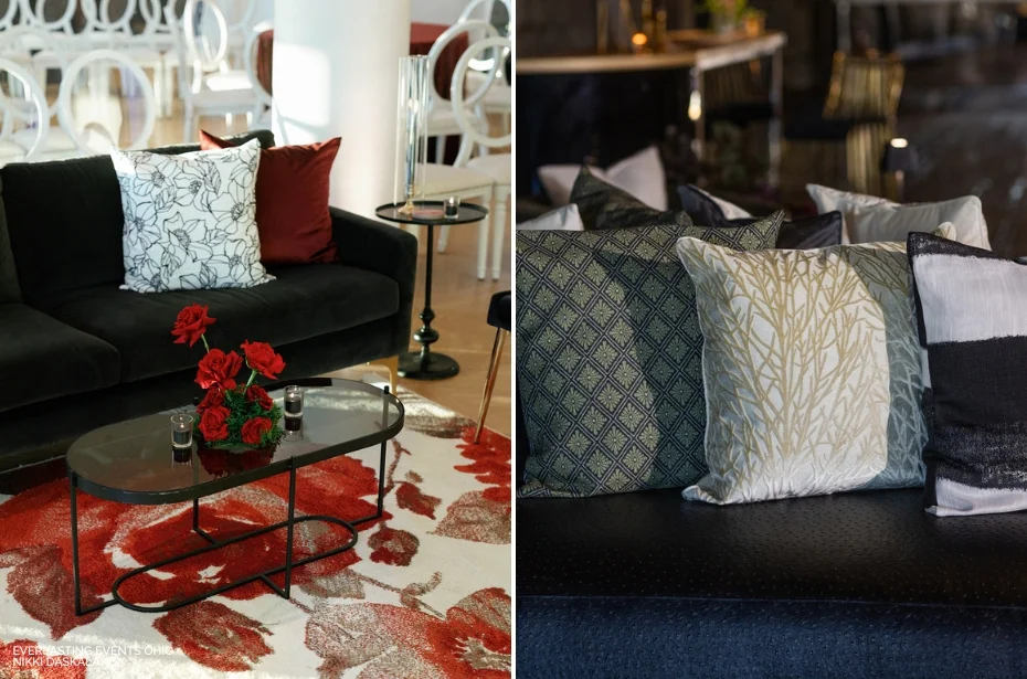 Side-by-side living room setups: left features a black sofa with red and white accents, roses, and a floral rug; right shows a dark sofa with patterned pillows in a subdued color palette.