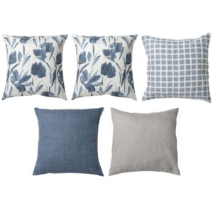 Five decorative pillows with blue and gray patterns, including floral, checkered, and solid designs, arranged in two rows.