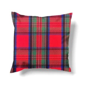 A square pillow featuring a tartan plaid holly berry pattern in red, green, and blue.