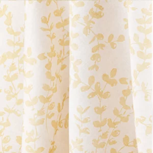 Close-up of the Westerly Dusty Rose curtain with a light-colored background and yellow floral pattern, including branches and leaves.